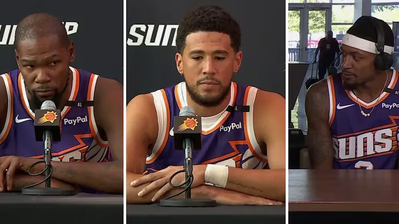 The Phoenix Suns' All-Star trio of Kevin Durant, Devin Booker, and Bradley Beal stands together during a press conference, reflecting on their disappointing debut season and looking forward to Year 2 with new coach Mike Budenholzer and an improved roster, aiming to overcome past challenges and pursue their championship dreams.